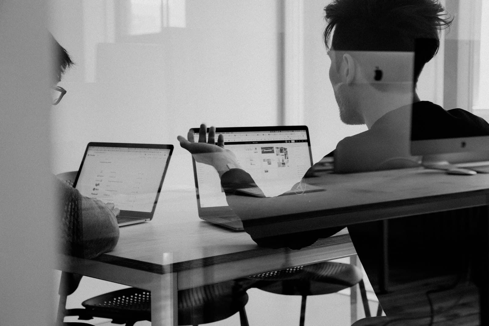 Solar sales manager reviewing AI appointment feedback with a rep